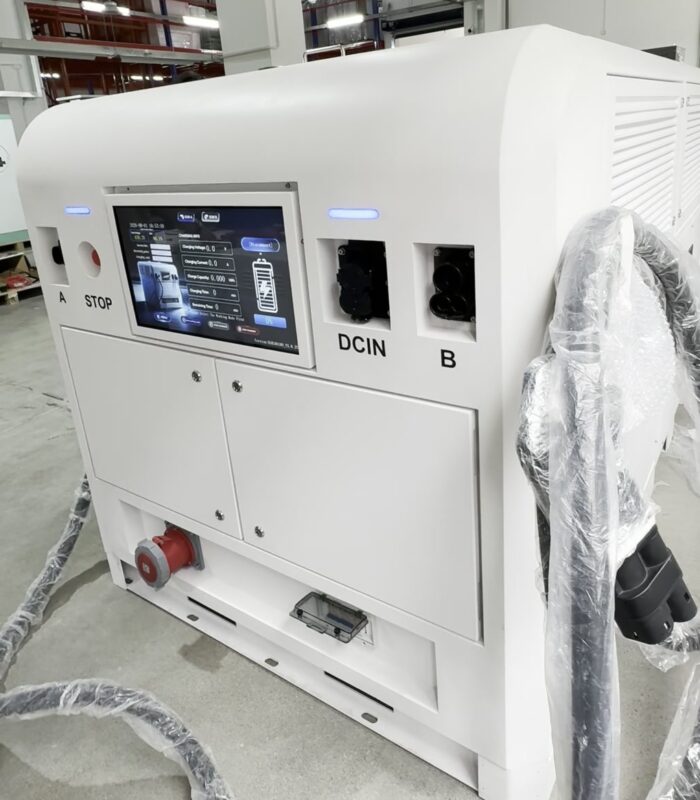 EG-Nova 150 Dual 150kW battery-integrated DC fast EV charger with 180kWh LiFePO4 storage - three-quarter view showing dual-gun HMI, STOP button, DCIN inlet and 20kW PV-ready body